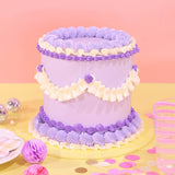 Vintage Cake - Tonal Colour by Crumbs & Doilies, tall 6-layer sponge cake with purple and cream Swiss Meringue icing decoration